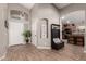 Inviting entryway featuring high ceilings, wood-look tile flooring, and ample natural light at 43121 W Sunland Dr, Maricopa, AZ 85138