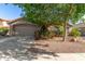 Charming single-story home with a well-manicured front yard and a two-car garage at 43121 W Sunland Dr, Maricopa, AZ 85138