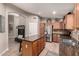 Well-lit kitchen with stainless steel appliances and a central island at 43121 W Sunland Dr, Maricopa, AZ 85138