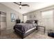 Comfortable main bedroom featuring neutral colors and a ceiling fan at 43121 W Sunland Dr, Maricopa, AZ 85138