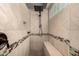 Modern walk-in shower boasts decorative tile accents and a convenient built-in bench at 43121 W Sunland Dr, Maricopa, AZ 85138