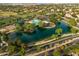 Gorgeous aerial view showcasing a lake, pool, and recreational facilities within a well-maintained community at 4322 S Ranger Trl, Gilbert, AZ 85297