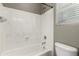 Bathroom showcasing white tub/shower combo, white marbled shower walls, and neutral paint at 4322 S Ranger Trl, Gilbert, AZ 85297