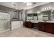 Luxurious primary bathroom with a glass shower, soaking tub, and a double sink vanity at 4322 S Ranger Trl, Gilbert, AZ 85297