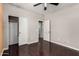 Bedroom featuring closet and bathroom doors, with hardwood floors and neutral paint at 4322 S Ranger Trl, Gilbert, AZ 85297