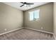 Bedroom with neutral paint, ceiling fan, carpeted floors and a window with blinds at 4322 S Ranger Trl, Gilbert, AZ 85297