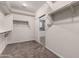 Walk-in closet featuring carpeted floor and lots of hanging storage space at 4322 S Ranger Trl, Gilbert, AZ 85297