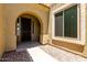 Inviting home entryway featuring a covered porch, security door, and a view to the interior at 4322 S Ranger Trl, Gilbert, AZ 85297