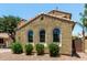 Home featuring a textured exterior, arched windows, and well-maintained landscaping for enhanced curb appeal at 4322 S Ranger Trl, Gilbert, AZ 85297
