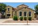 Beautiful home showcasing a well-maintained front yard with lush greenery and a textured exterior at 4322 S Ranger Trl, Gilbert, AZ 85297