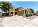 Inviting two-story home with a spacious driveway, neutral exterior, and well-maintained landscaping at 4322 S Ranger Trl, Gilbert, AZ 85297