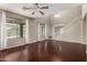 Bright living room with hardwood floors, a ceiling fan, and views to the backyard at 4322 S Ranger Trl, Gilbert, AZ 85297