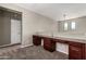 Bright open loft area with built-in desk, and neutral paint tones throughout at 4322 S Ranger Trl, Gilbert, AZ 85297