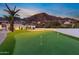 Backyard with a putting green, a basketball court, and scenic mountain views at 4763 N 53Rd St, Phoenix, AZ 85018