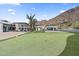 Lush backyard with putting green, modern home, and mountain views, perfect for outdoor entertainment at 4763 N 53Rd St, Phoenix, AZ 85018