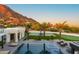 Resort-style backyard with pool, putting green, basketball court, and stunning mountain views at 4763 N 53Rd St, Phoenix, AZ 85018