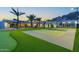 Expansive backyard featuring a well-maintained basketball court and manicured landscaping at 4763 N 53Rd St, Phoenix, AZ 85018