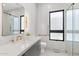 Elegant bathroom features modern fixtures, a glass shower, sleek vanity, and great natural light at 4763 N 53Rd St, Phoenix, AZ 85018