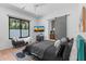 Modern bedroom with large windows, cozy seating, and bathroom with a sliding barn door at 4763 N 53Rd St, Phoenix, AZ 85018