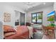 Cozy bedroom with a large window, work station, and a bathroom with a sliding door at 4763 N 53Rd St, Phoenix, AZ 85018
