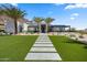 Striking contemporary home with desert landscaping, featuring modern design and a pathway to the entrance at 4763 N 53Rd St, Phoenix, AZ 85018