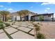 Contemporary home with modern desert landscaping, featuring concrete pavers and desert accents at 4763 N 53Rd St, Phoenix, AZ 85018