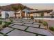 Contemporary home features sleek design, desert landscaping, and a unique paver driveway at 4763 N 53Rd St, Phoenix, AZ 85018