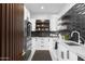Stylish kitchen with custom cabinetry, modern hardware, and stainless steel refrigerator at 4763 N 53Rd St, Phoenix, AZ 85018