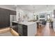 Modern kitchen flows seamlessly into the open floor plan with a large island and stainless steel appliances at 4763 N 53Rd St, Phoenix, AZ 85018