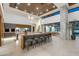 Contemporary open-concept kitchen with oversized island, bar seating, and high ceilings at 4763 N 53Rd St, Phoenix, AZ 85018