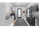 Modern laundry room featuring sleek cabinetry, and high-end washer and dryer at 4763 N 53Rd St, Phoenix, AZ 85018