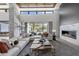A modern living room offers an open layout with a fireplace and seamless indoor-outdoor living at 4763 N 53Rd St, Phoenix, AZ 85018