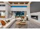 Modern living room featuring a large sectional sofa, stylish fireplace, and seamless indoor-outdoor living at 4763 N 53Rd St, Phoenix, AZ 85018