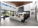 Bright, open living room featuring a fireplace, soaring ceilings, and a seamless indoor-outdoor flow at 4763 N 53Rd St, Phoenix, AZ 85018
