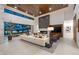 Bright living room with modern fireplace, wood ceiling, and disappearing glass doors to outdoor living space at 4763 N 53Rd St, Phoenix, AZ 85018