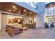 Inviting outdoor living area with comfortable seating, heaters, and views of the luxurious backyard at 4763 N 53Rd St, Phoenix, AZ 85018