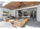 Outdoor living space featuring a fireplace, comfortable seating, and an outdoor TV at 4763 N 53Rd St, Phoenix, AZ 85018