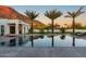 Stunning pool area with palm trees, lounge chairs, a basketball court, and mountain views at 4763 N 53Rd St, Phoenix, AZ 85018
