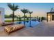 Serene pool area with lounge furniture, palm trees, and a basketball court, perfect for relaxation and recreation at 4763 N 53Rd St, Phoenix, AZ 85018