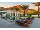 Beautiful pool with lounge chairs, palm trees, and mountain views provide a relaxing outdoor space at 4763 N 53Rd St, Phoenix, AZ 85018