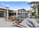 Expansive pool and outdoor space with luxury seating, palm trees, and views of the multi-story modern home at 4763 N 53Rd St, Phoenix, AZ 85018