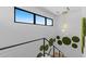 Bright staircase with contemporary railing, decorative wall art, and modern chandelier at 4763 N 53Rd St, Phoenix, AZ 85018