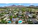 Beautiful aerial of a neighborhood featuring a house with pool, with mountains in the distance at 5307 N 32Nd Pl, Phoenix, AZ 85018
