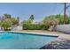 Beautiful backyard pool featuring privacy landscaping, a white fence, and citrus trees at 5307 N 32Nd Pl, Phoenix, AZ 85018