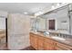 Bathroom vanity with double sinks, granite countertops, and decorative tile work at 5307 N 32Nd Pl, Phoenix, AZ 85018