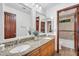 Bathroom vanity with double sinks, granite countertops, and wood cabinets at 5307 N 32Nd Pl, Phoenix, AZ 85018