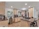 Open kitchen with stone floors, granite countertops, stainless appliances, and ample counter space at 5307 N 32Nd Pl, Phoenix, AZ 85018