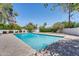 A pristine pool with a stone tile surround, perfect for relaxation and entertaining at 5307 N 32Nd Pl, Phoenix, AZ 85018