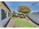 A custom backyard featuring a putting green and lush desert landscaping at 5307 N 32Nd Pl, Phoenix, AZ 85018