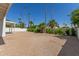 Backyard view featuring landscaping and a shaded patio area at 5909 E Crocus Dr, Scottsdale, AZ 85254